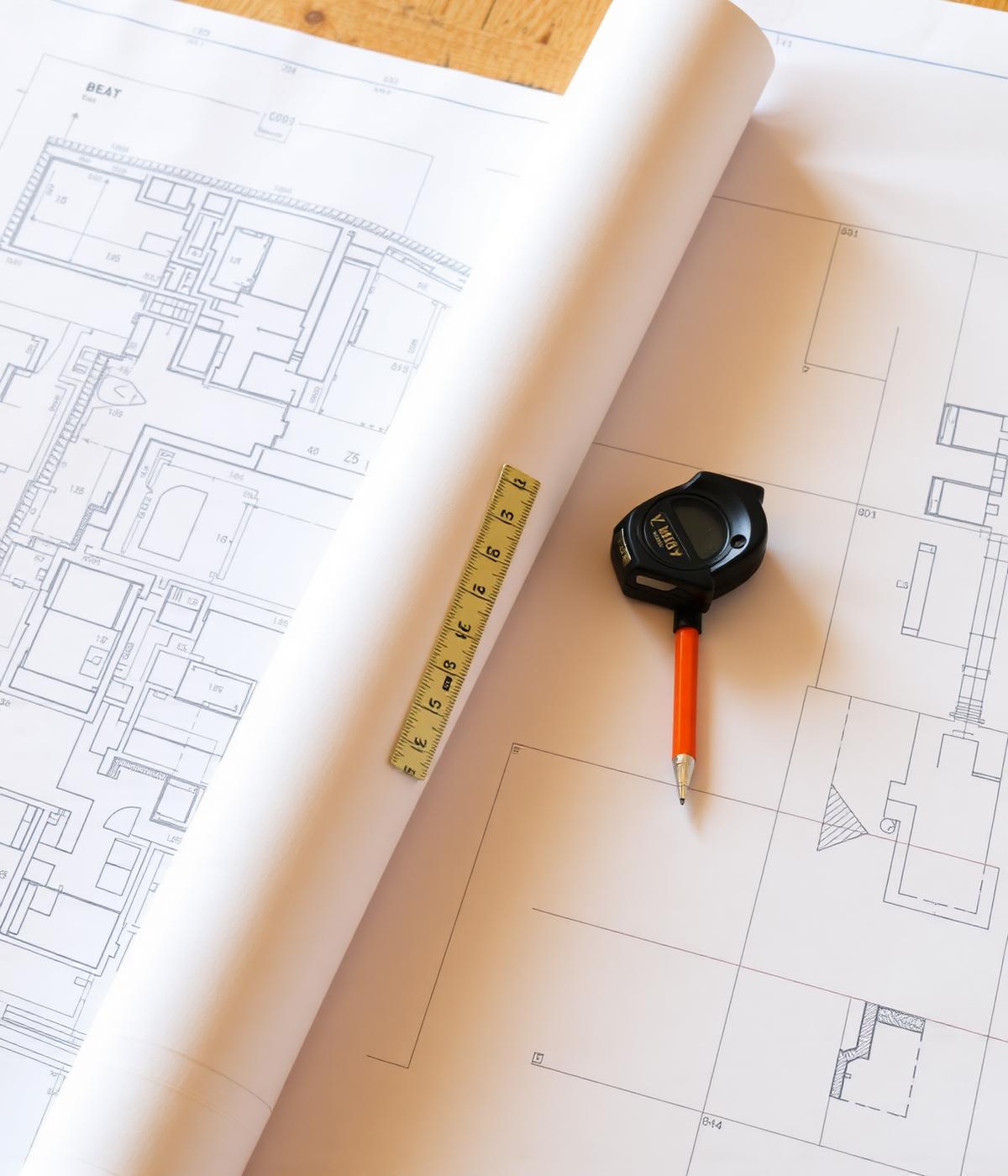 Blueprints and tools on a workbench